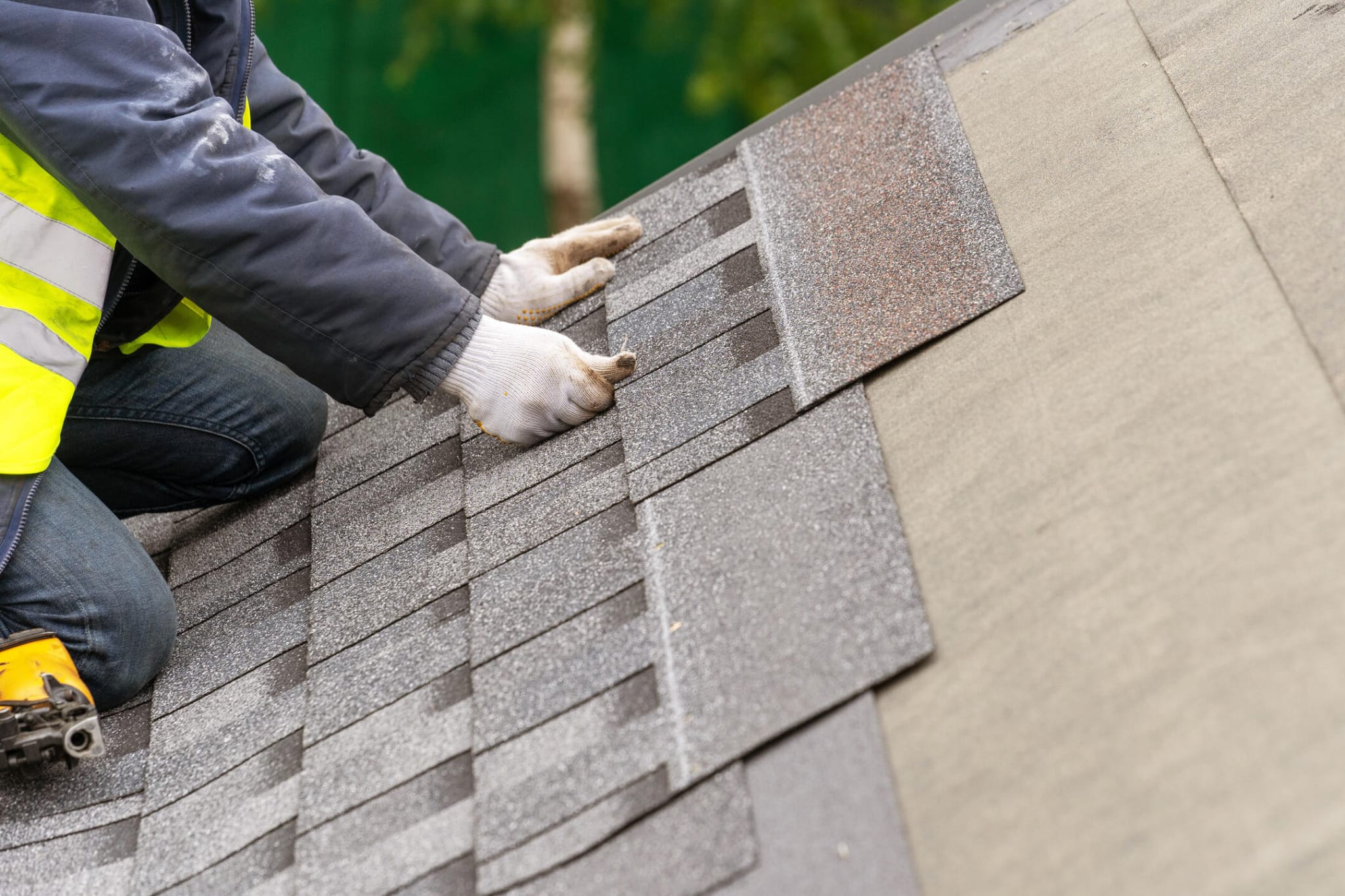 Close-up of premium GAF Timberline architectural shingles being installed by Summit Peak crew