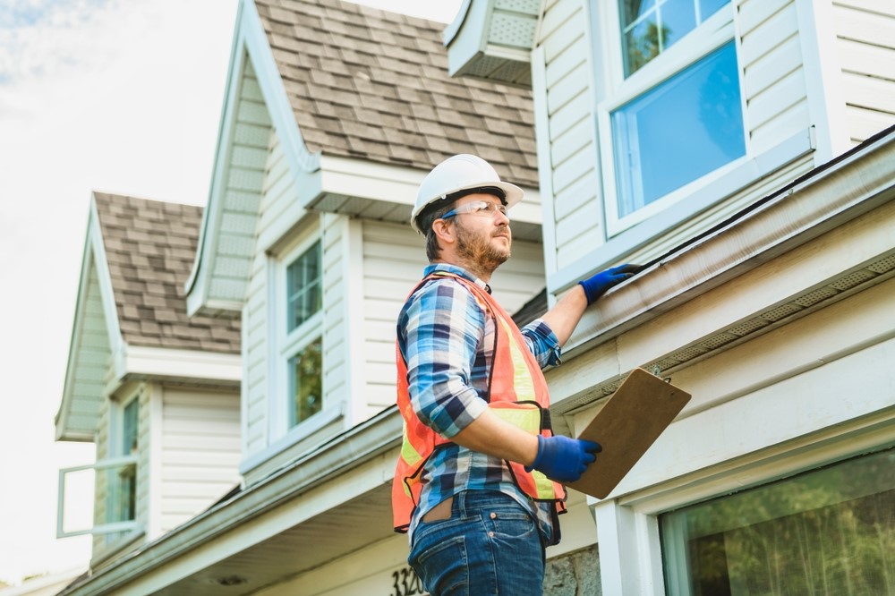 Summit Peak Roofing team preparing insurance claim documentation for an Edmonton homeowner